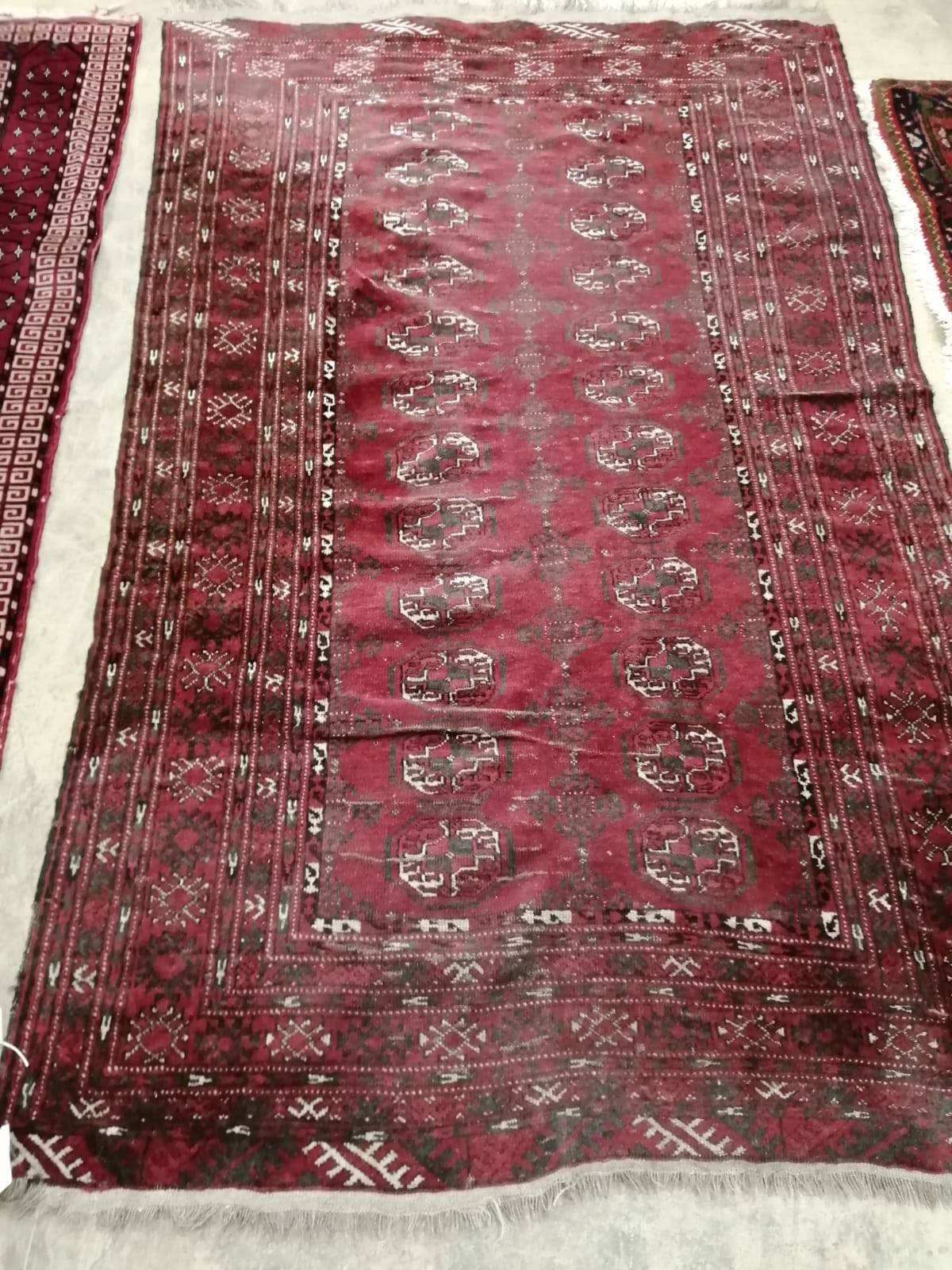 Two Bokhara / Belouch red ground rugs, larger 190 x 120cm